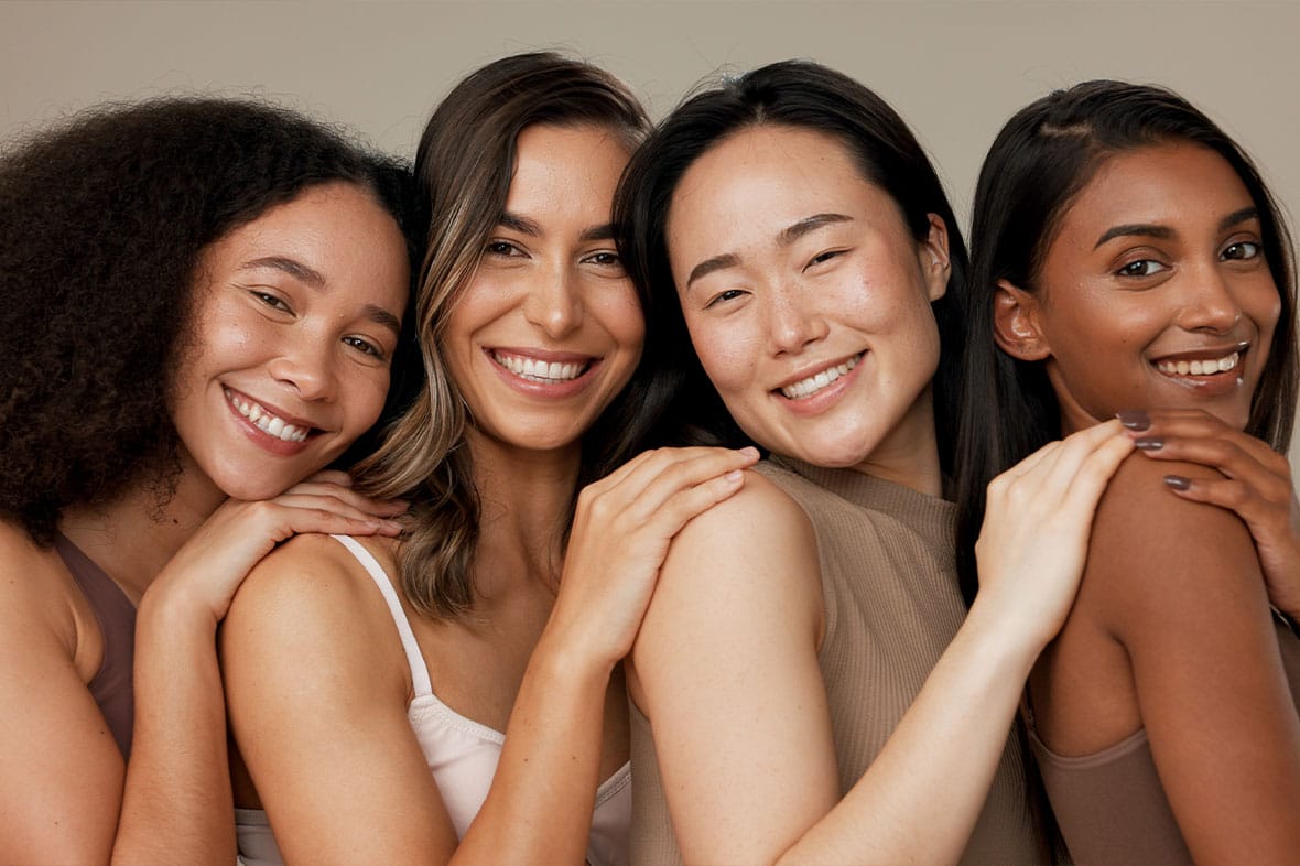 group of woman happy after getting ethnic rhinoplasties