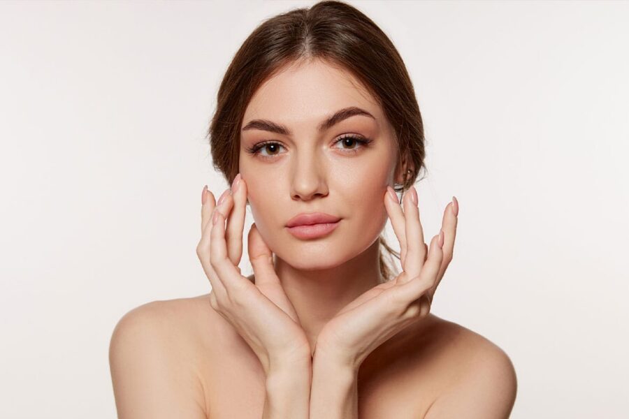 woman after getting facial fat grafting in NYC