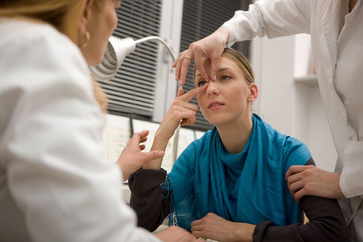 woman getting a rhinoplasty consultation in New York City