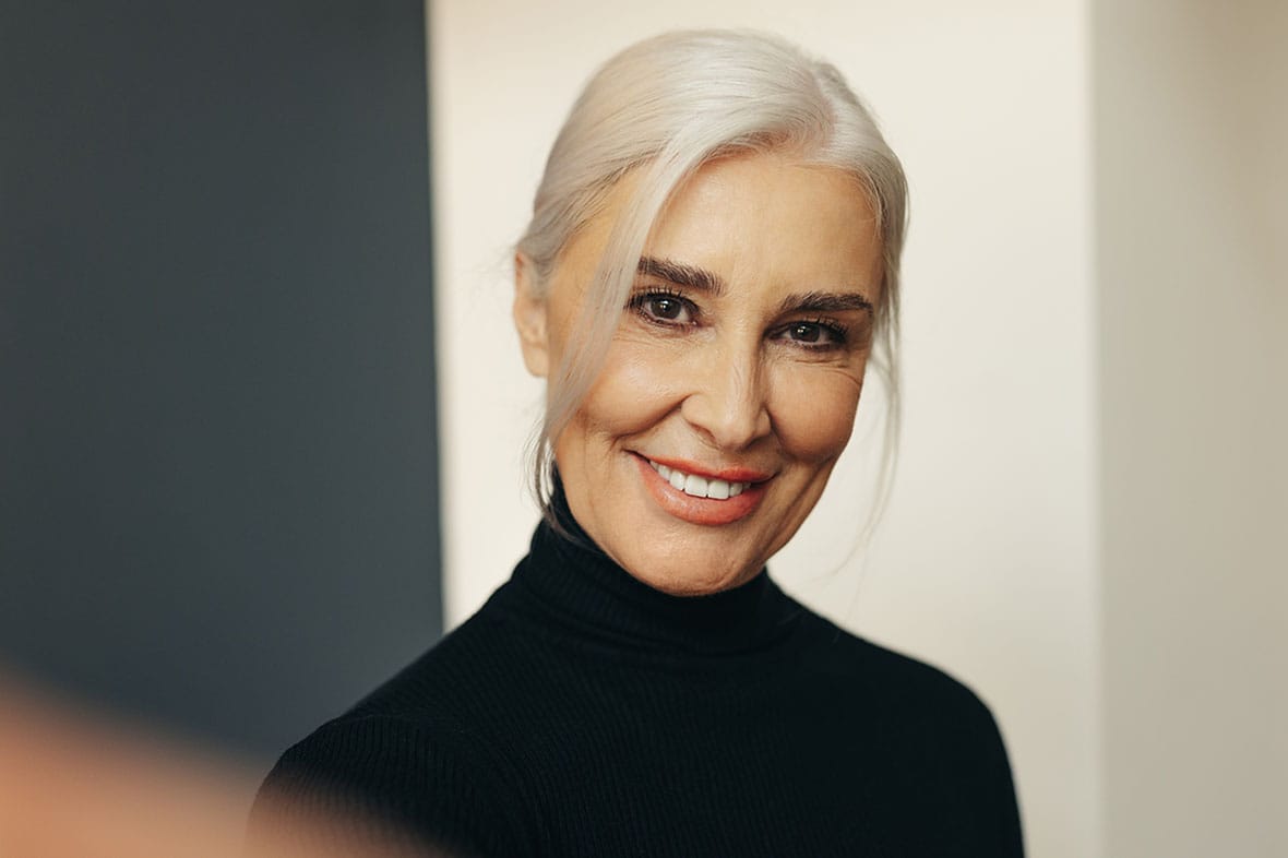 older woman smiling after her deep plane facelift in NYC