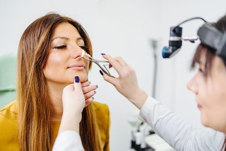 woman getting a rhinoplasty consultation after a nose injury in NYC