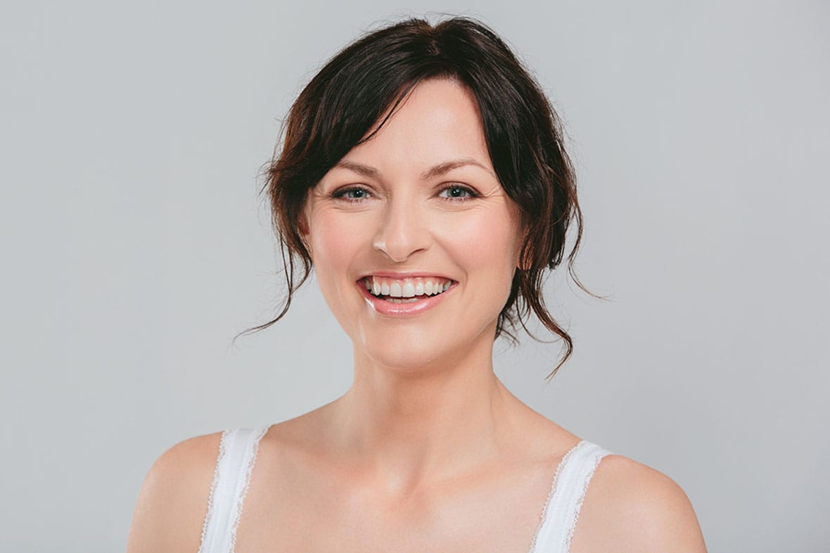 woman after getting facial fat grafting in NYC